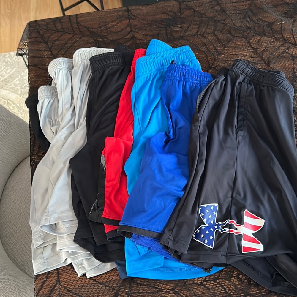 9 pairs of youth size XL Under Armour shorts